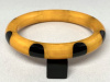 SZ84 Shultz 8 black dots on butterscotch bakelite bangle